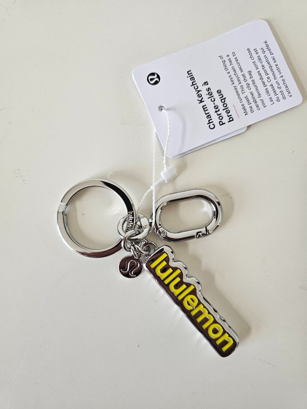 NWT LULULEMON LEMN/SLVR Yellow Silver Metal Charm Keychain One Size OS
